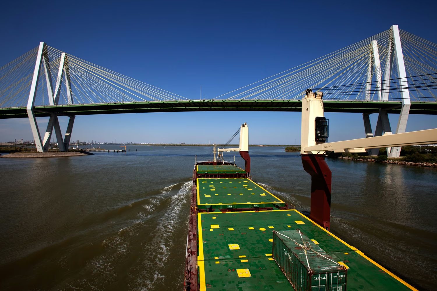 Cargo ship passing under the Fred Hartman Bridge on the Houston Ship Channel